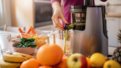 What to do with pulp from juicing:Preparing cold pressed juice in the kitchen.