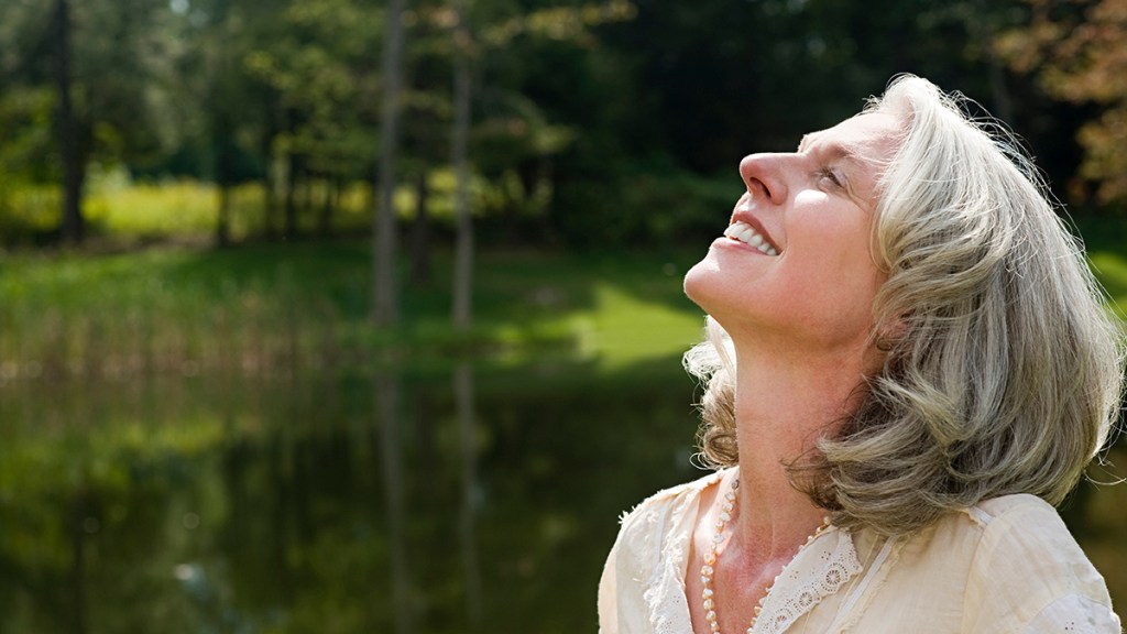 woman deep breathing looking relaxed