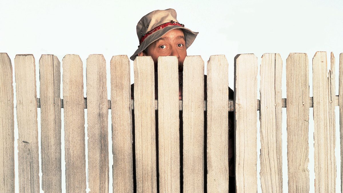 Earl Hindman hides his face as Wilson W. Wilson, Jr. in Home Improvement, 1991