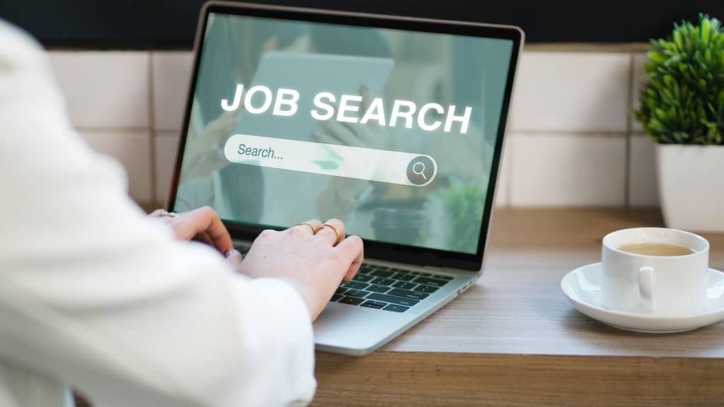 Marriott work from home jobs: A woman searches for job openings online using a computer app, searching for new vacancies on a website and using a job search application