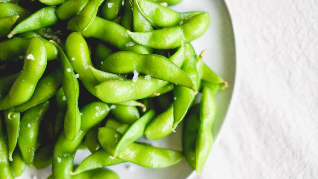 Edamame sprinkled with salt, which is a top menopause self-care strategy
