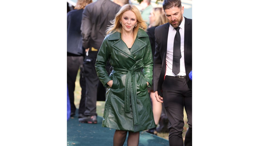 Kylie Minogue in green leather coat