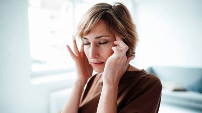 woman with headache; natural headache remedies