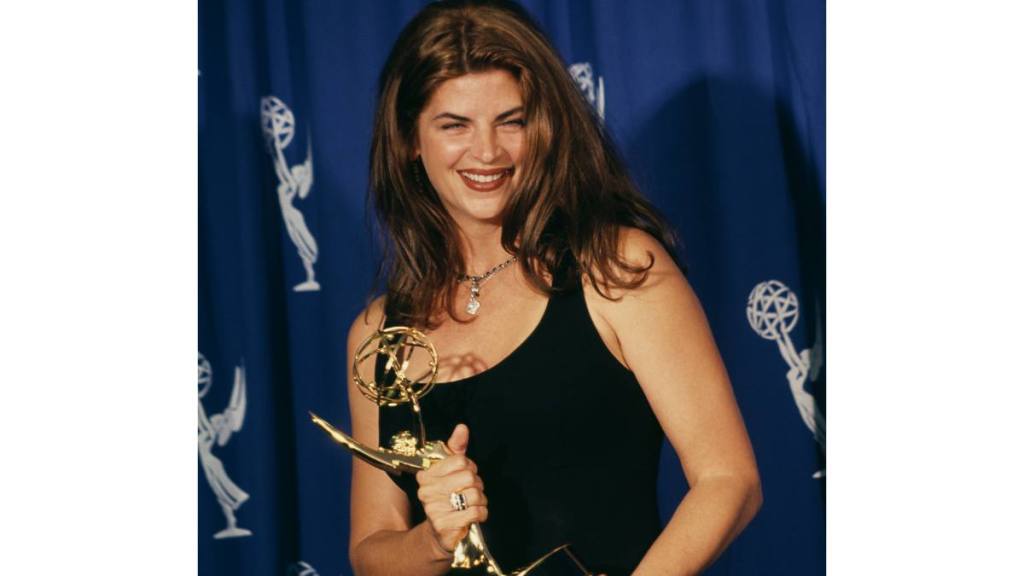 Kirstie Alley holding an Emmy award