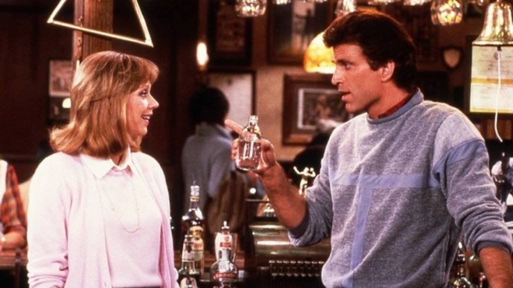 Man and woman discussing at a bar; ted danson movies and tv shows