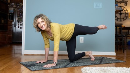 Marianne Richmond doing fire hydrant yoga pose for back pain