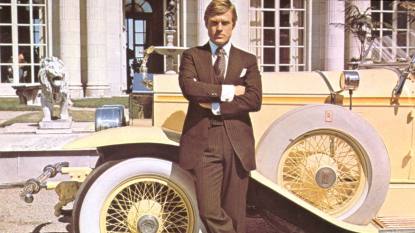 man standing in front of a car; the great gatsby