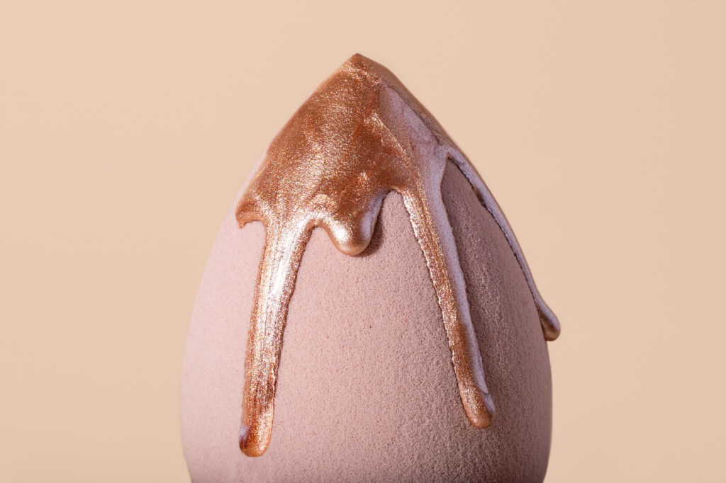 beauty blender with bronzing drops dripping down