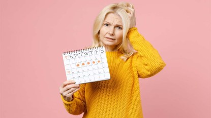 Woman holding a period calendar