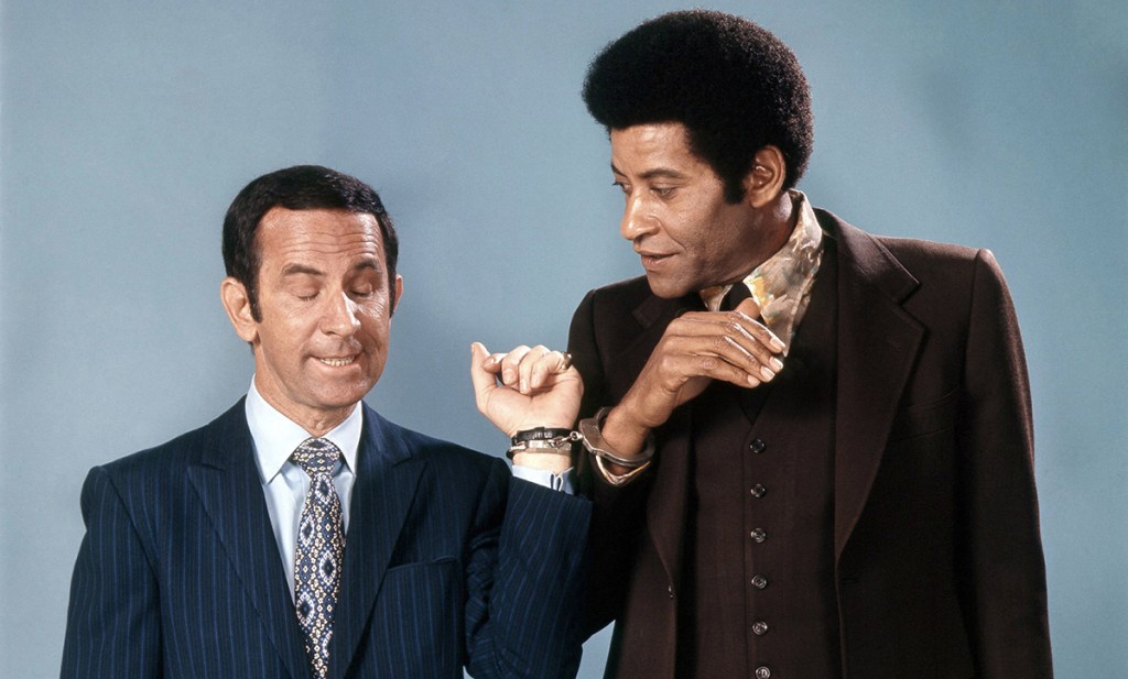 Don Adams and ruper Crosse in The Partners, 1971