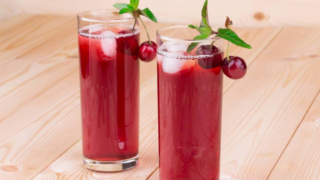 sleepy girl mocktail: cherry smoothie on the wooden background isolated in closeup