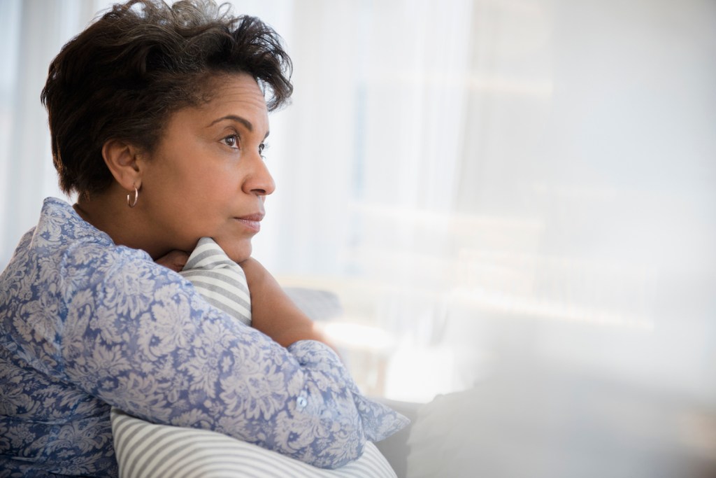 Woman shown in profile thinking and practicing hopefulness