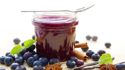 jarred blueberry compote with blueberries and a spoon