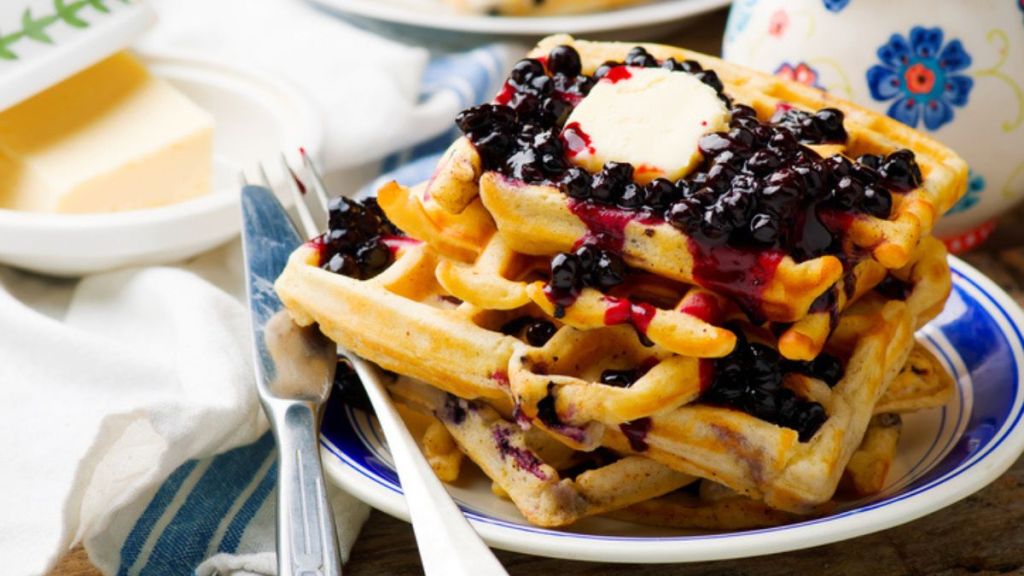 lemon ricotta waffles with blueberry compote on plate