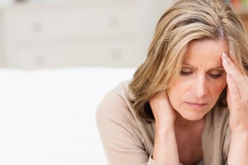 Woman experiencing a migraine