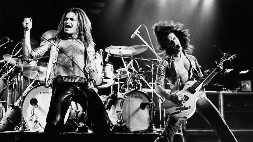 Two men in band performing; Van Halen members