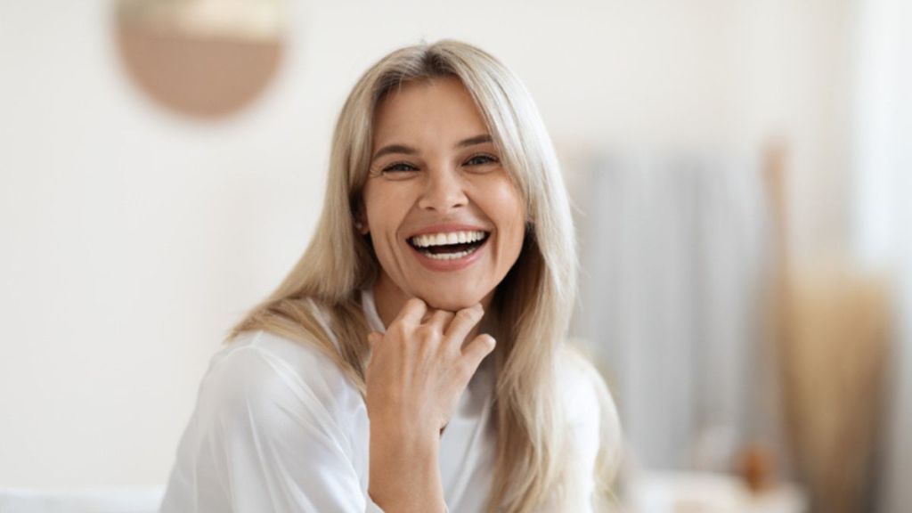 A mature woman smiling after taking creatine