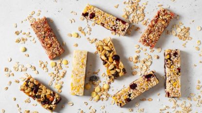 different flavored homemade granola bars spread out against white background