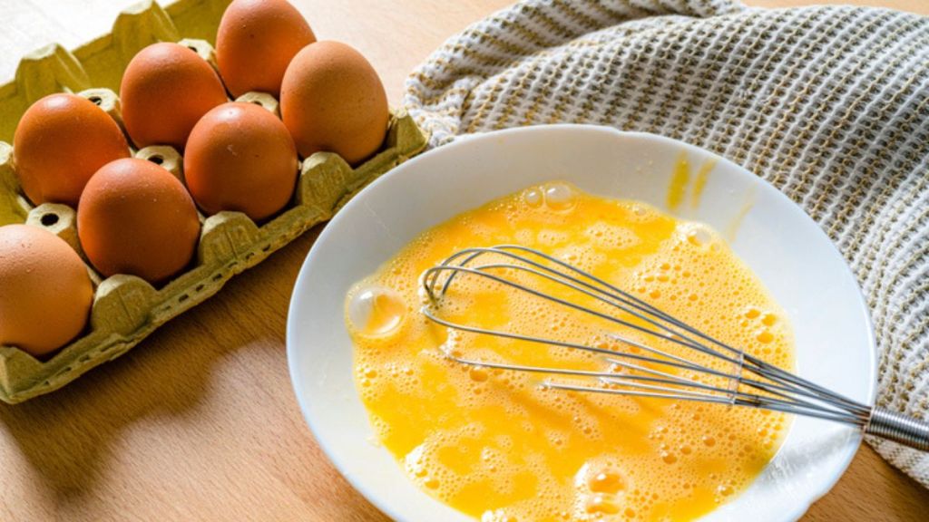 whisked eggs in a bowl for a microwave omelette recipe