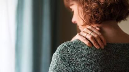 woman having shoulder pain