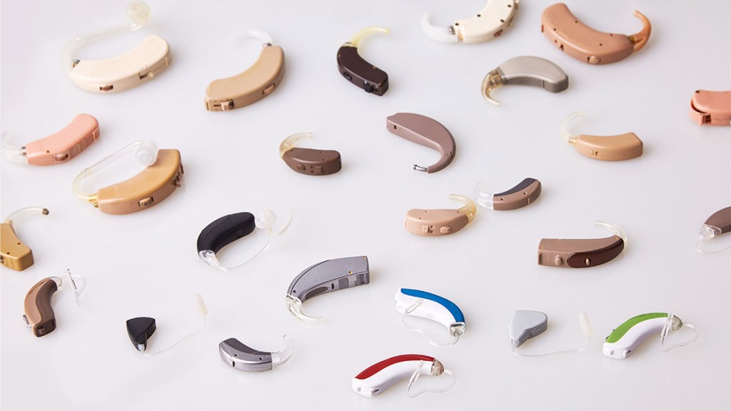 array of hearing aids, like you'd get at Walmart, on a table
