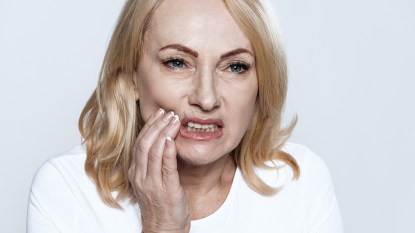 A woman suffering from TMJ who needs masseter Botox