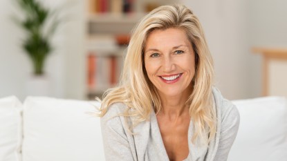 Woman over 50 with beautiful hair because of root spray