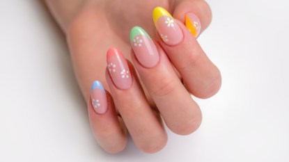 Colorful french tip nails with flowers.