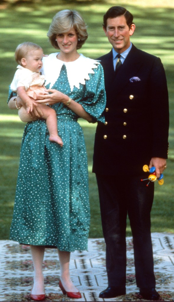 Prince Charles, Prince of Wales and Diana, Princess of Wales, wearing a green dress with white polka dots and a white puritan collar designed by Donald Campbell, pose with their baby son, Prince William, in the gardens of Government House on April 18, 1983 in Auckland, New Zealand
