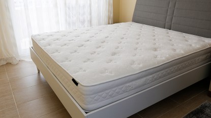 Bare mattress that contains fiberglass