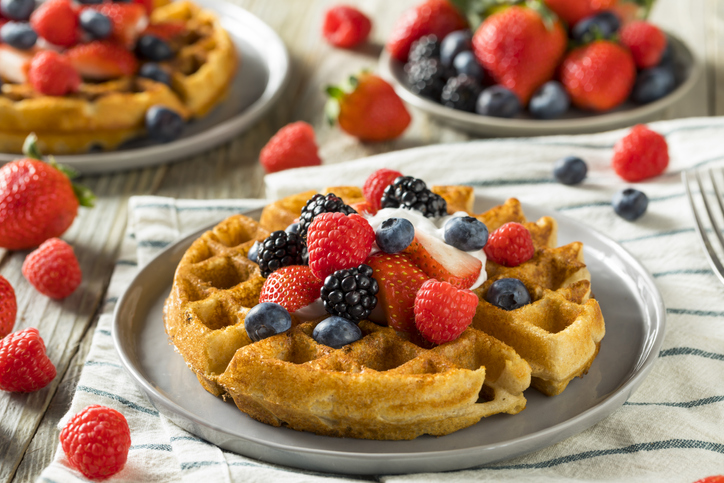Belgian waffle topped with mixed berries.