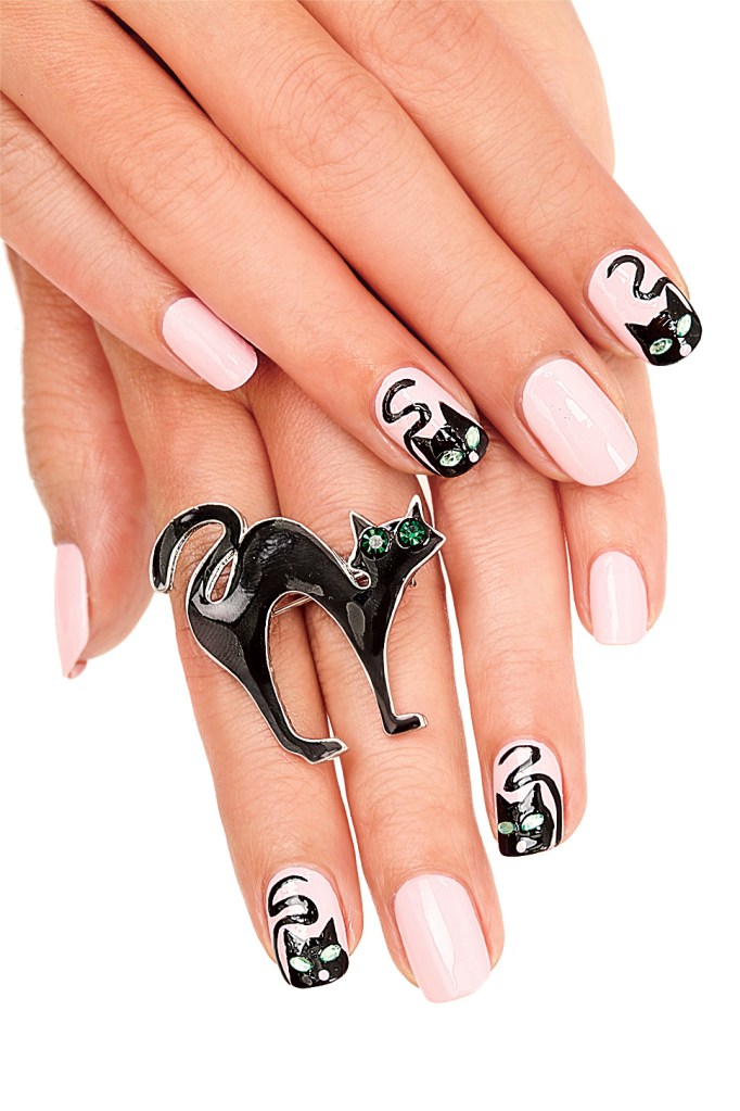 Black cat design on light pink nails