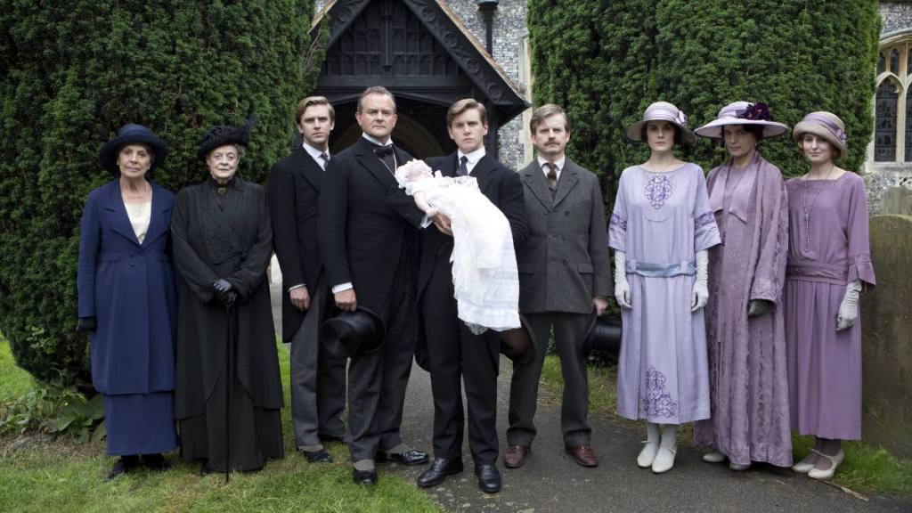 Downton Abbey Cast poses in purples, whites and greens 