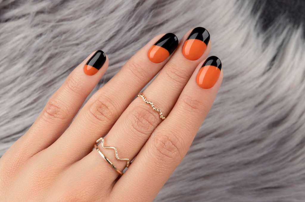 Orange and black Halloween nail design.