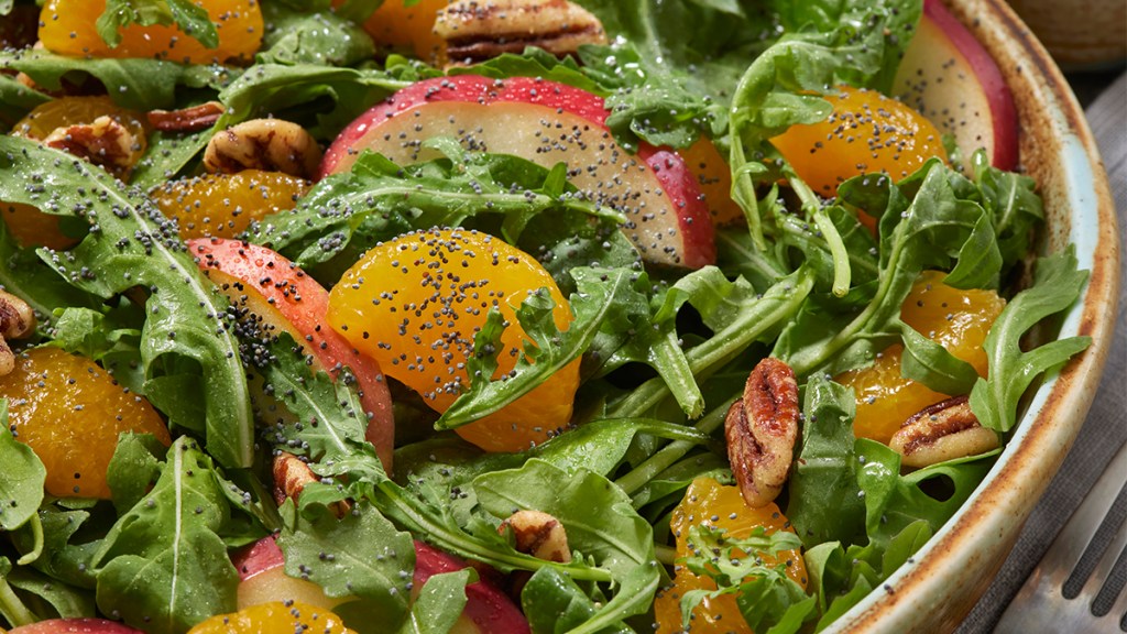 salad topped with fruit, nuts and seeds, part of a 30-day plant-based diet plan