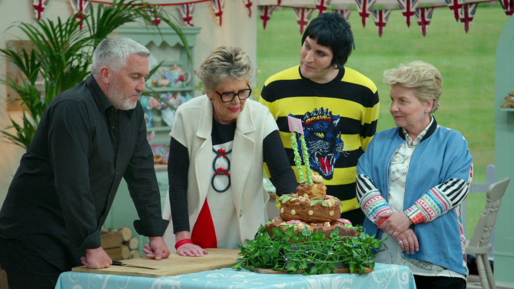 Judges on 'The Great British Baking Show' looking at a cake best baking shows on netflix