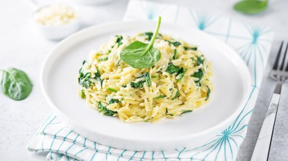 A creamy spinach orzo as part of a guide on using it as a swap for rice