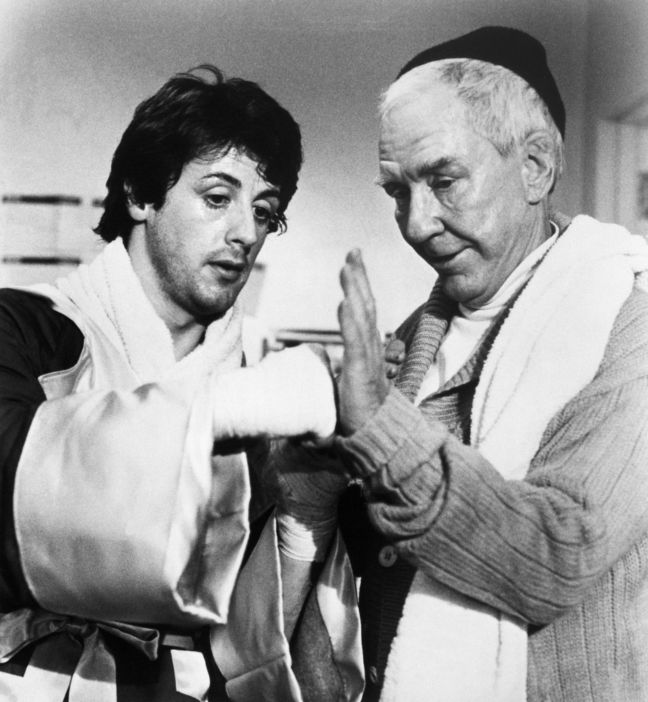 (Original Caption) Actor Sylvester Stallone, described as looking like Rock Hudson sculpted from mashed potatoes, wrote the script to "Rocky" and then got the title role. Film tells of an unknown Philadelphia boxer who, with the help of trainer (Burgess Meredith), R, takes a crack at the World Heavyweight Boxing championship. Scene from the movie. Movie still, 1976.