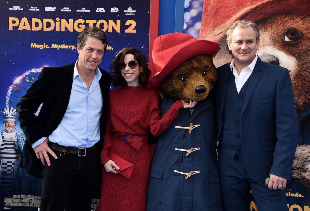 WESTWOOD, CA - JANUARY 06: (L-R) Actors Hugh Grant, Sally Hawkins, Paddington Bear and Hugh Bonneville arrive at the premiere of Warner Bros. Pictures' "Paddington 2" at the Regency Village Theatre on January 6, 2018 in Westwood, California. (Photo by Amanda Edwards/WireImage)