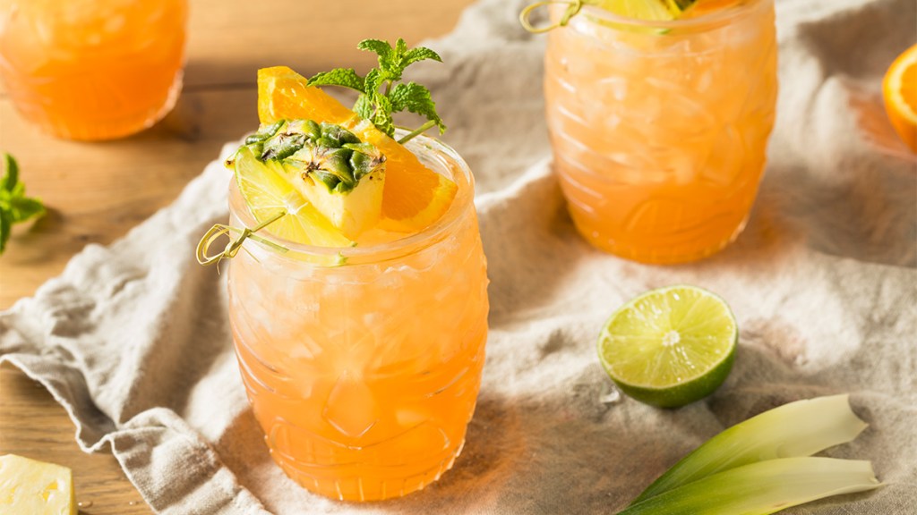 A recipe for Pineapple-Orange Oasis drinks as part our a guide on using mezcal (alcohol) in cocktails