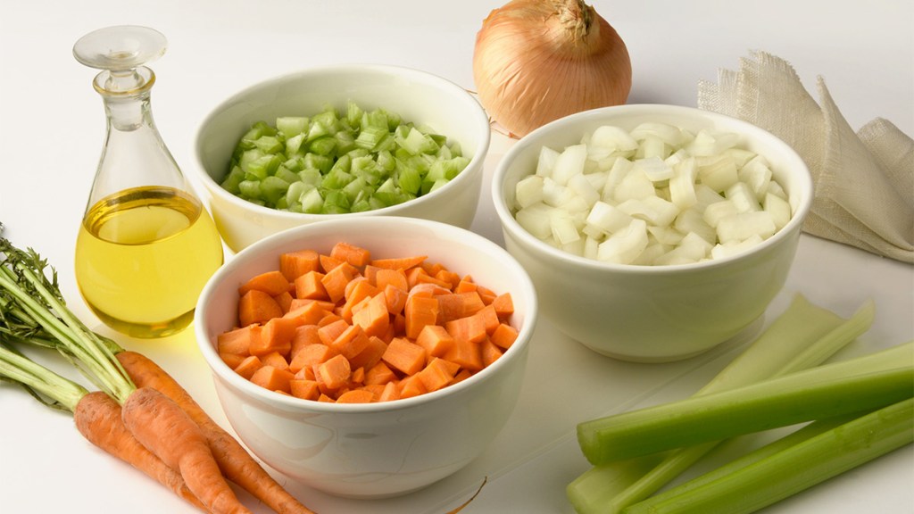 An array of onions, carrots and celery to make for soffritto