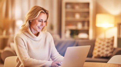 woman working from home on her laptop in the evening