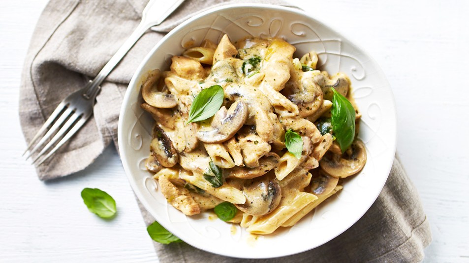 Caramelized French onion pasta with mshrooms served in a bowl