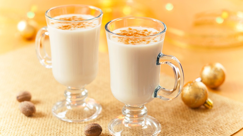 Two glasses of eggnog as part of a guide describing what it tastes like and its uses