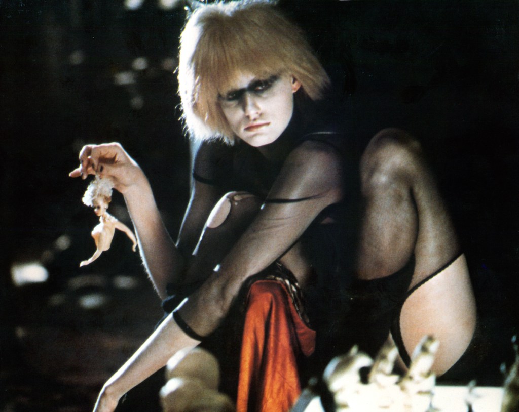 Daryl Hannah holds a mutilated doll by the hair in a scene from the film 'Blade Runner', 1982