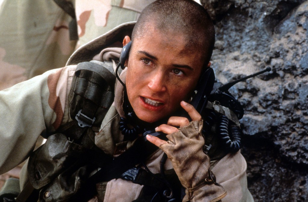 Demi Moore talking on walkie talkie in a scene from the film 'G.I. Jane', 1997