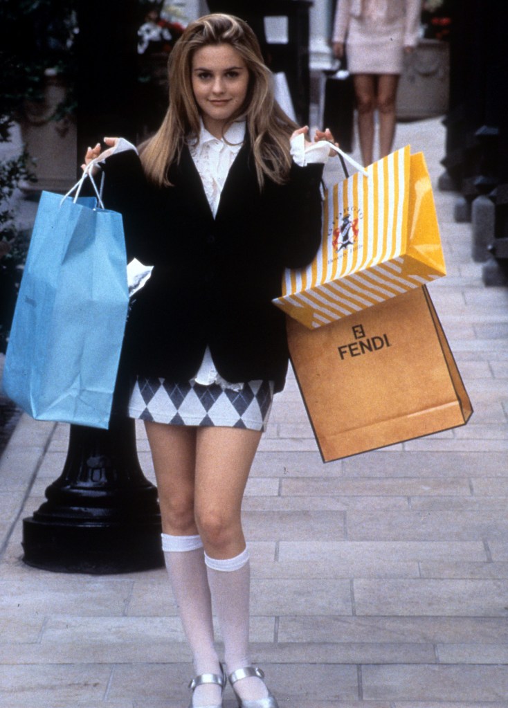 Woman holding shopping bags in a scene from the film 'Clueless', 1995