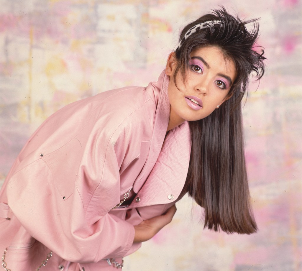 Portrait of Phoebe Cates in pink outfit in 1986