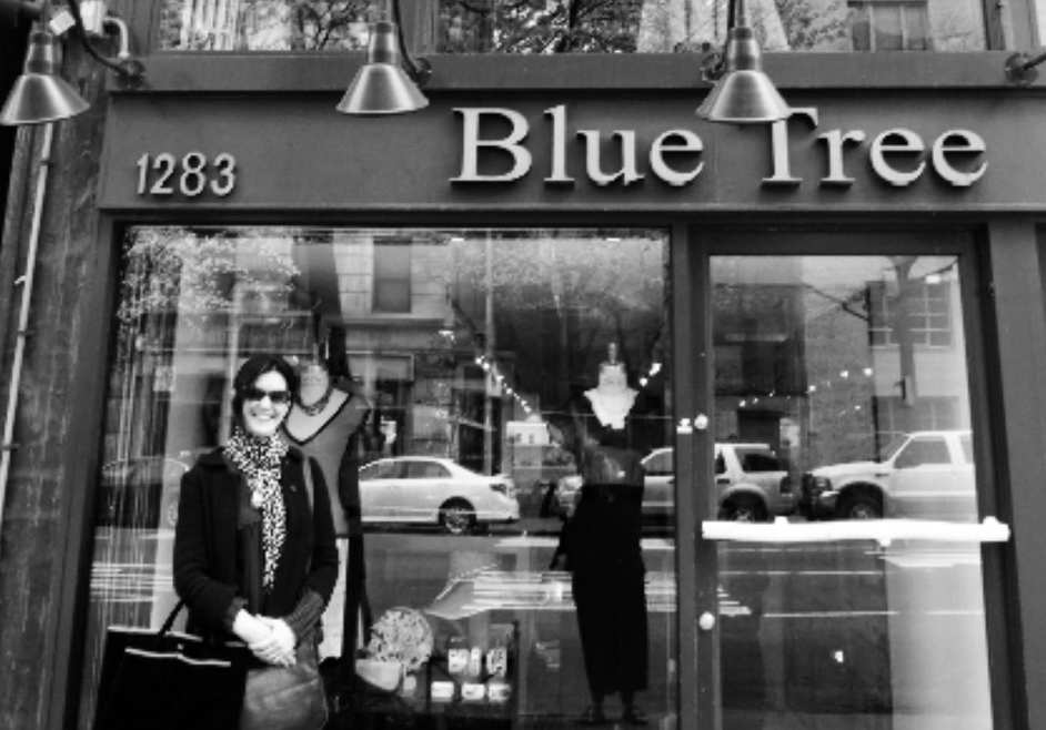 Phoebe Cates posing in front of her boutique, Blue Tree