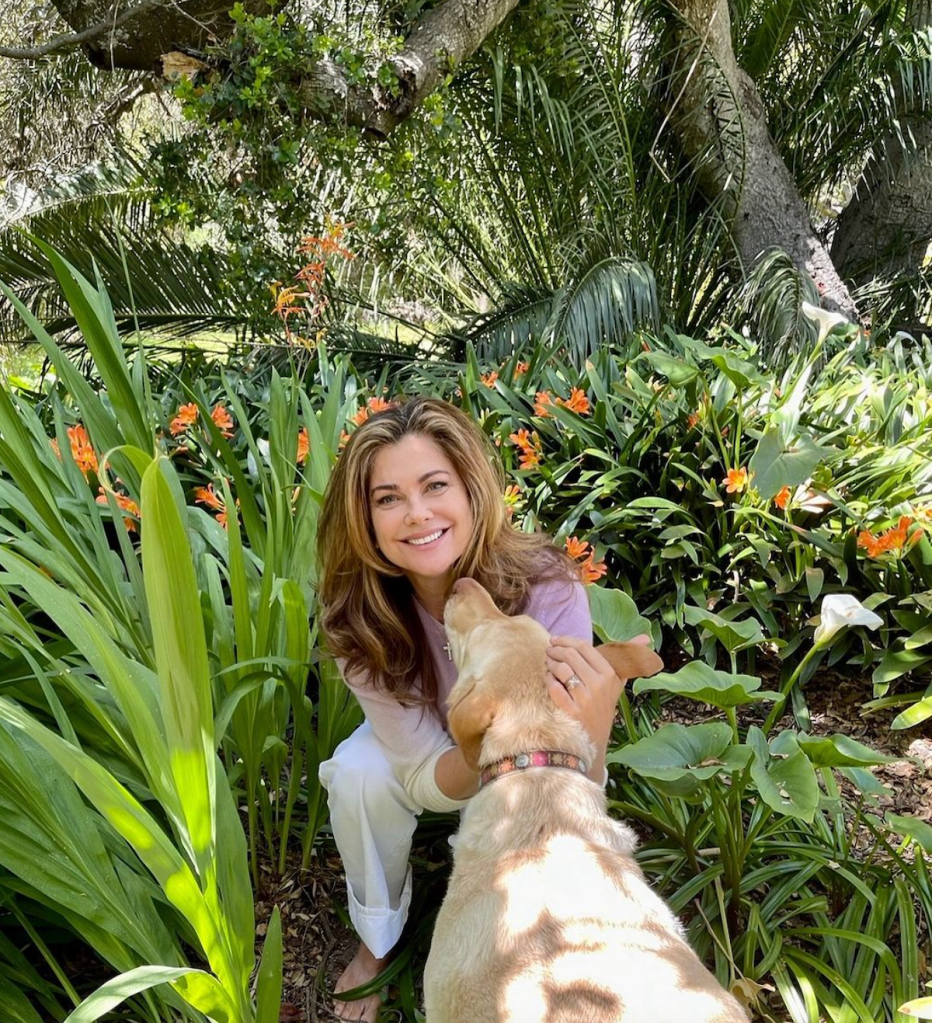 Kathy Ireland outdoors with her dog in 2023